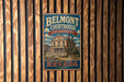 A vintage metal sign for Belmont Courthouse, a historic site in Nevada, is displayed on a wooden wall.