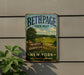 A vintage metal sign for Bethpage State Park, featuring a scenic landscape with a golf course and trees, mounted on a wall.