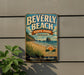 A vintage-style metal sign for Beverly Beach State Park in Oregon, featuring a beach scene with a mountain in the background.
