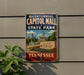 A vintage-style metal sign for the historic Capitol Mall State Park in Tennessee, featuring a cityscape and the text "Bicentennial Capitol Mall State Park" in a patriotic design.