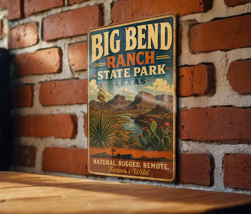 A vintage-style metal sign for Big Bend Ranch, Texas, featuring a desert landscape with mountains, cacti, and a river.