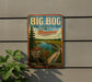 A vintage-style metal sign for the Big Bog State Recreation Area in Minnesota, featuring a scenic landscape with a wooden bridge and a river.