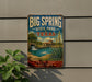 A vintage-style sign for Big Spring State Park in Texas, featuring a scenic landscape with a waterfall and a building.