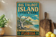 A vintage-style sign for Big Talbot Island, Florida, featuring a tropical beach scene with palm trees and a large tree trunk.