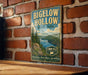 A vintage-style metal sign for Bigelow Hollow State Park, featuring a scenic landscape with pine trees, a lake, and mountains.