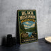 A vintage-style metal sign for Black Moshannon State Park in Pennsylvania, featuring a scenic landscape with pine trees and a lake.