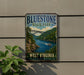 A vintage-style metal sign for Bluestone State Park, featuring a scenic image of a bridge over a river surrounded by lush greenery.