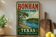 A vintage-style sign for Bonham State Park in Texas, featuring a scenic landscape with a river and trees.