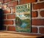 A vintage-style sign for Booker T. Washington State Park in Tennessee, featuring a scenic landscape with a river and a bridge.