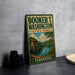 A vintage metal sign for Booker T. Washington State Park in Tennessee, featuring a scenic illustration of a lake and a bridge.