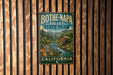 A vintage metal sign for Bothe-Napa Valley State Park in California, featuring a scenic image of a river and mountains.