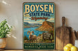 A vintage-style metal sign for Boysen State Park in Wyoming, featuring a scenic landscape with a ram, a lake, and mountains.