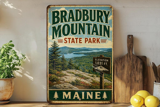 A vintage-style metal sign for Bradbury Mountain State Park in Maine, featuring a scenic landscape with pine trees, mountains, and a lake.