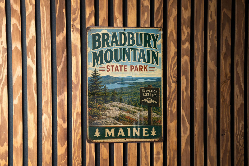 A vintage metal sign for Bradbury Mountain State Park in Maine, featuring a scenic landscape with pine trees and mountains.