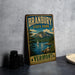 A vintage-style metal sign for Branbury State Park in Vermont, featuring a scenic landscape with a lake, mountains, and a sailboat.