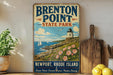 A vintage-style metal sign for "Brenton Point State Park" in Newport, Rhode Island, featuring a lighthouse and a coastal landscape with sailboats.