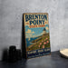 A vintage metal sign for "Brenton Point State Park" in Newport, Rhode Island, featuring a lighthouse and a sailboat on the ocean.