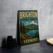 A vintage-style sign for Brighton State Park in Vermont, featuring a scenic landscape with mountains, pine trees, and a lake.