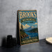 A vintage-style sign for Brooks Memorial State Park in Washington, featuring a scenic landscape with a mountain, lake, and pine trees.