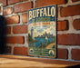 A vintage-style metal sign for Buffalo Harbor State Park in New York, featuring a lighthouse and a cityscape, is displayed on a brick wall.