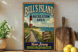 A vintage-style metal sign for Bull's Island Recreation Area in New Jersey, featuring a lighthouse, a wooden boardwalk, and a sign for nature, adventure, and memories.