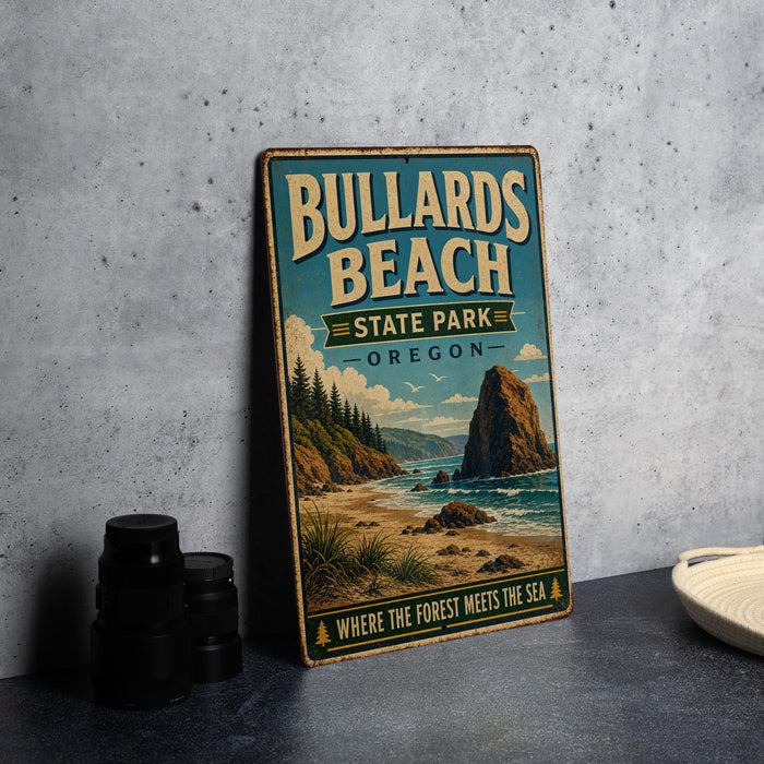 A vintage-style metal sign for Bullards Beach State Park in Oregon, featuring a scenic landscape with a rocky outcrop, beach, and ocean.