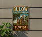 A vintage-style sign for Bulow Plantation Ruins, a historic state park in Florida, featuring a picture of the ruins and palm trees.