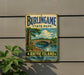 A vintage metal sign for Burlingame State Park, Rhode Island, featuring a scenic illustration of a bridge over a river surrounded by trees.