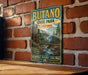 A vintage-style metal sign for Butano State Park in California, featuring a scenic landscape with a river, bridge, and trees.