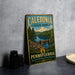 A vintage-style metal sign for Caledonia State Park in Pennsylvania, featuring a scenic landscape with a lake, mountains, and trees.