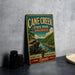A vintage-style sign for "Cane Creek State Park, Arkansas" is displayed on a gray wall, featuring a scenic landscape with a river and lush greenery.
