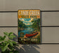 A vintage-style metal sign for Canoe Creek State Park in Pennsylvania, featuring a scenic illustration of a canoe on a river surrounded by trees and mountains.