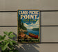 A vintage-style metal sign for Canoe-Picnic Point State Park in New York, featuring a scenic image of a lake, canoe, and forest.