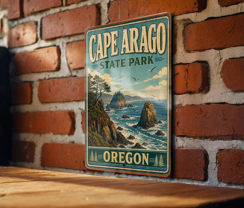 A vintage-style metal sign for Cape Arago State Park in Oregon, featuring a scenic coastal landscape with rocky cliffs, trees, and the ocean.