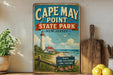A vintage-style sign for Cape May Point State Park in New Jersey, featuring a lighthouse and a beach scene.