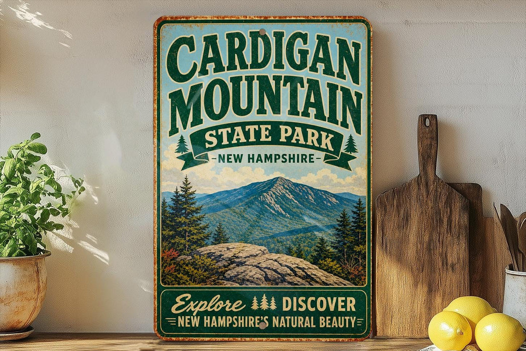 A vintage-style sign for Cardigan Mountain State Park in New Hampshire, featuring a scenic mountain landscape and the text "Explore, Discover, New Hampshire's Natural Beauty".