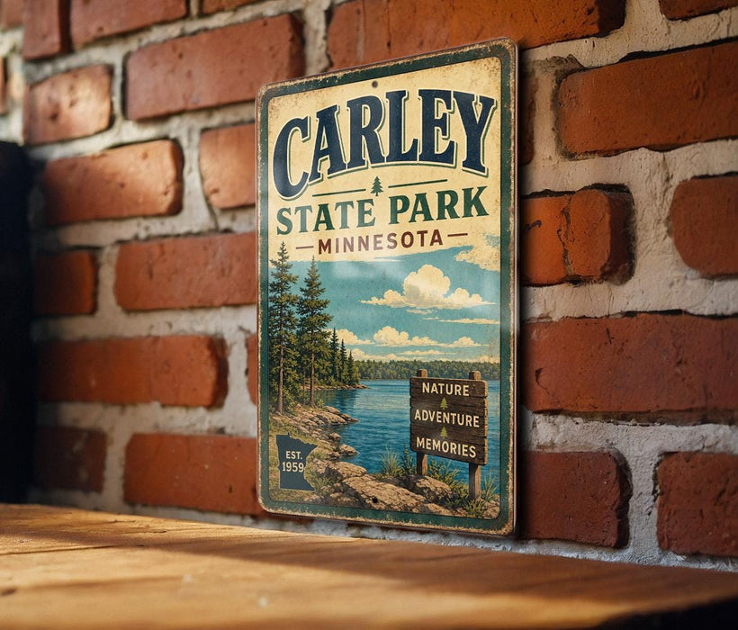A vintage metal sign for Carley State Park in Minnesota, featuring a scenic landscape with pine trees, a lake, and a sign indicating the park's nature, adventure, and memories.