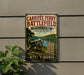a vintage-style sign for Carniffex Ferry Battlefield State Park in West Virginia, with a cannon and a gravestone in the foreground.