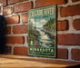 A vintage-style metal sign for Cascade River State Park in Minnesota, featuring a scenic illustration of the waterfall and forest.
