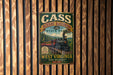 A vintage-style metal sign for Cass Scenic Railroad, featuring a train and the text "CASS SCENIC RAILROAD EST. 1901 STATE PARK WEST VIRGINIA Wild, Wonderful!"