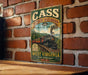 A vintage-style metal sign for Cass Scenic Railroad, featuring a train and the text "CASS SCENIC RAILROAD 1901 STATE PARK WEST VIRGINIA Wild Wonderful!"