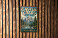 A vintage-style metal sign for Castle Crags State Park in California, featuring a mountain landscape and a river.