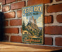 A vintage-style metal sign for Castle Rock State Park in California, featuring a scenic mountain landscape.