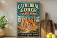 A vintage-style sign for Cathedral Gorge State Park in Nevada, featuring a scenic illustration of the canyon landscape.