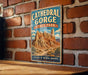 A vintage-style sign for Cathedral Gorge State Park in Nevada, featuring a scenic illustration of the canyon landscape.