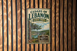 A vintage-style metal sign for Cedar of Lebanon State Park in Tennessee, featuring a scenic illustration of the park's natural beauty.