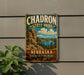 A vintage-style metal sign for Chadron State Park in Nebraska, featuring a scenic landscape with mountains, trees, and a lake.