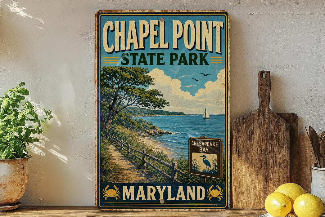 A vintage-style sign for Chapel Point State Park in Maryland, featuring a scenic coastal landscape with a path leading to the beach and a sailboat in the distance.