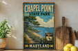 A vintage-style sign for Chapel Point State Park in Maryland, featuring a scenic coastal landscape with a path leading to the beach and a sailboat in the distance.
