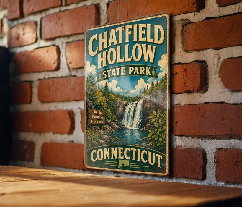 A vintage metal sign for Chatfield Hollow State Park in Connecticut, featuring a scenic illustration of a waterfall surrounded by lush greenery.